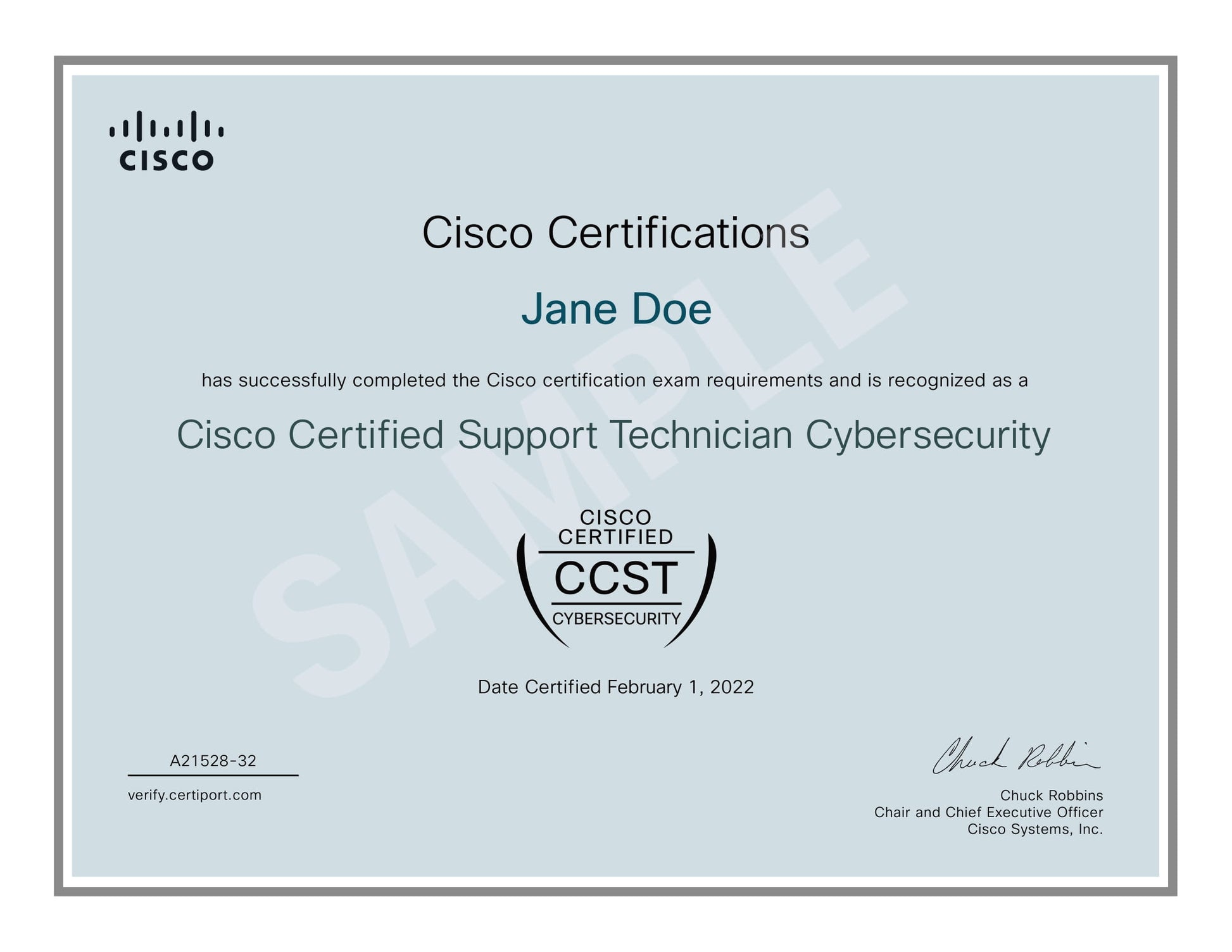 Sample Cisco Certified Support Technician Cybersecurity certificate awarded to 'Jane Doe' by Cisco, dated February 1, 2022, signed by Chuck Robbins, Chair and CEO of Cisco Systems, Inc. The certificate confirms successful completion of Cisco certification exam requirements, includes the Cisco logo, CCST Cybersecurity emblem, certificate ID (A21528-32), and verification link (verify.certiport.com), on a light blue background with a gray border.